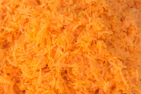grated carrot macro on plate selective focusの写真素材