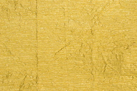 golden color creased metallic foil background texture
