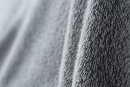 gray fluffy textile background selective focusの写真素材