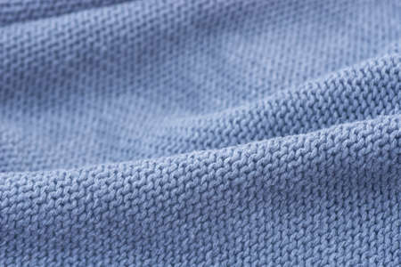 blue knitwear weaved textile texture background selective focus