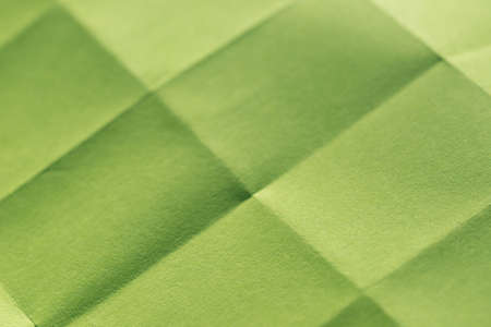 green sheet of paper folded background textureの写真素材