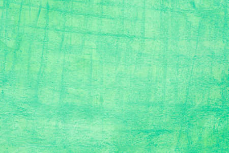 green color artistic background texture made with watercolor and crayon on paper