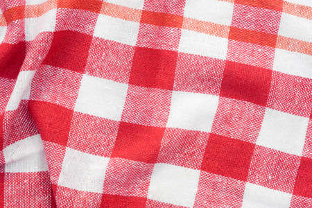 red and white checkered creased  kitchen towel background texture