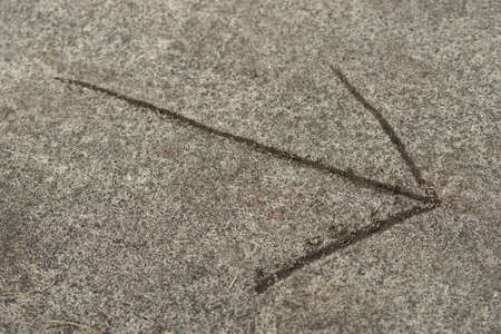 arrow sign on ground selective focus macro