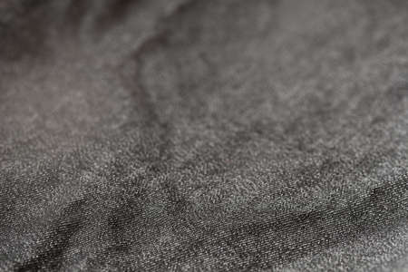 creased dark textile selective focus background texture macro