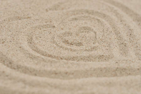hearts shapeon sand background selective focus closeupの写真素材
