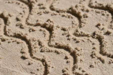 wave pattern - drawing on sand backgroundの写真素材