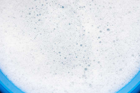 soap foam an bubbles on water background selective focus