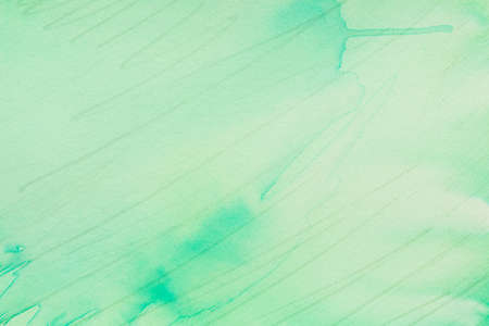 green color painted on paper background textureの写真素材