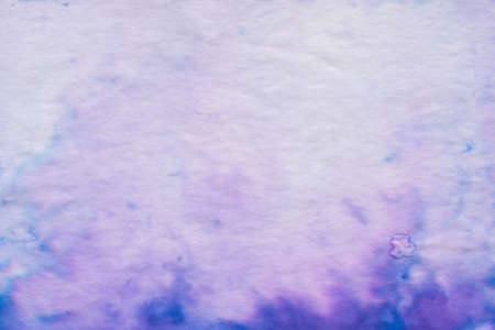 lila color painted on paper background textureの写真素材