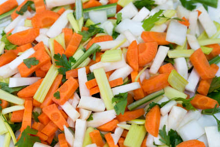raw vegetable pieces for vegetarian soup on plateの写真素材