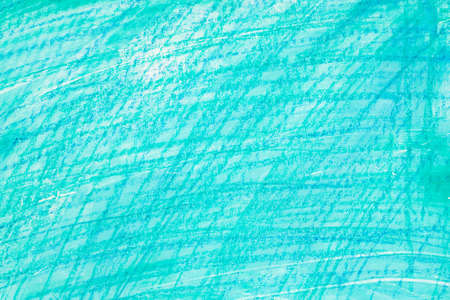 turquoise color crayon drawing on paper background textureの写真素材