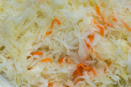 Sauerkraut, cut fermented cabbage on plate closeup selective focusの写真素材