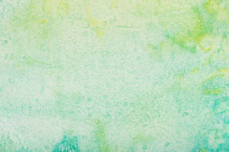 green and yellow painted watercolor painted on paper background texture