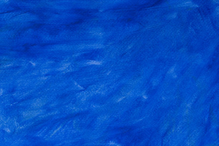 blue painted acrylic background on paper textureの写真素材