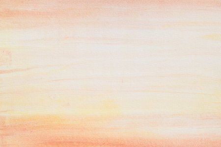 light color orange painted watercolor painted background textureの写真素材