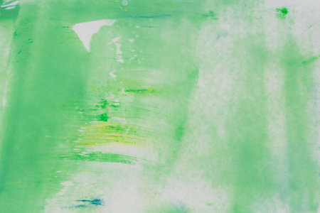 green and white painted watercolor on paper background textureの写真素材