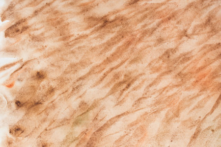 brown painted watercolor background on paper textureの写真素材