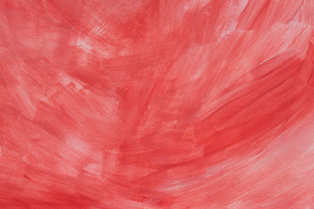 red watercolor painted background on paper textureの写真素材