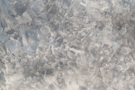 gray painted watercolor background on paper textureの写真素材
