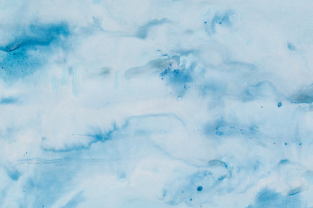 blue color painted background on paper textureの写真素材
