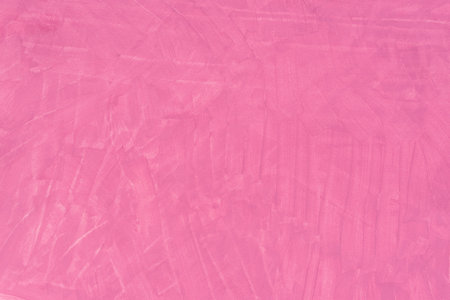pink color painted background on paper textureの写真素材