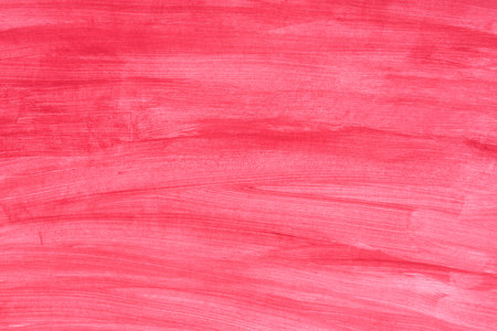 red painted watercolor background on paper textureの写真素材
