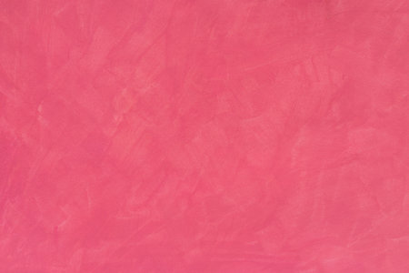 red painted watercolor background on paper textureの写真素材