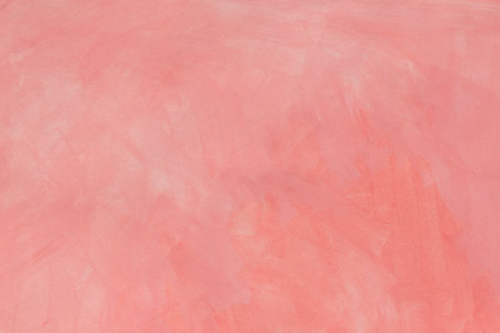 pink painted watercolor background on paper textureの写真素材