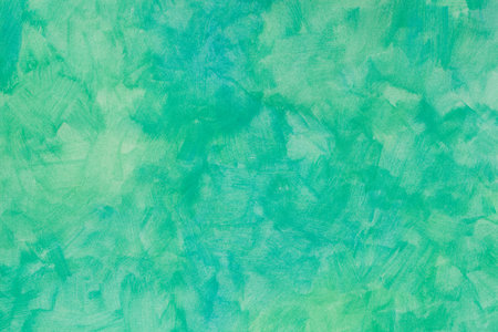green painted watercolor background on paper texture