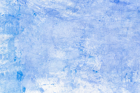 blue painted watercolor on paper background textureの写真素材