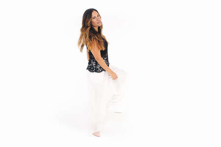 Full body portrait of young woman, isolated over white backgroundの写真素材