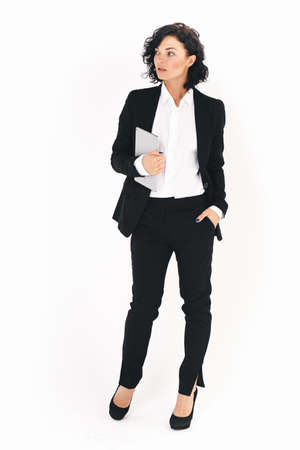 Full body portrait of young woman, isolated over white background.の写真素材