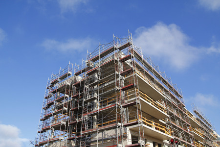 Construction of a building, with scaffold