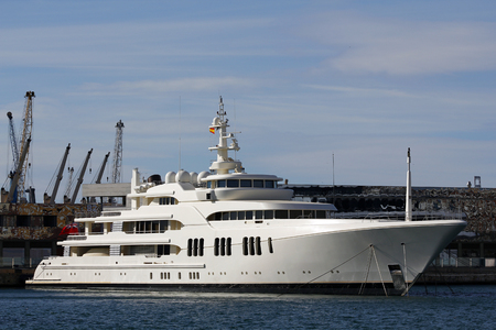 Luxury yacht moored at harborの写真素材