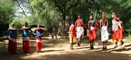 SAMBURU RESERVE, KENYA - JUNE 8, 2009  Group of unidentified African men and women from Samburu tribe show a traditional jump dance and clothes, on June 8, 2009 in a local village near Samburu National park のeditorial素材