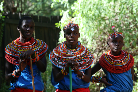 SAMBURU RESERVE, KENYA - JUNE 08, 2009  Group of african girls from Samburu tribe in Kenya, show their traditional clothes on June 08, 2009 in a local village near Samburu National park のeditorial素材