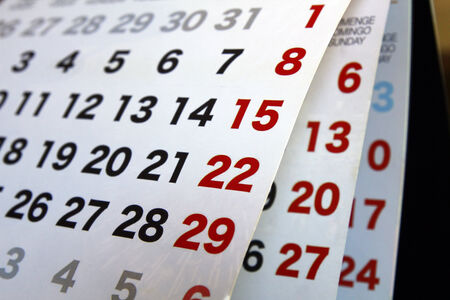 Calendar with open pages, numbers on red and blackの写真素材