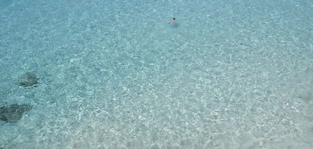 Transparent water in a mediterranean beachの写真素材