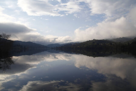 Foggy landscape in a lakeの写真素材