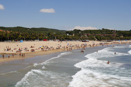 People relaxing and having fun on the beach to have their holidaysのeditorial素材