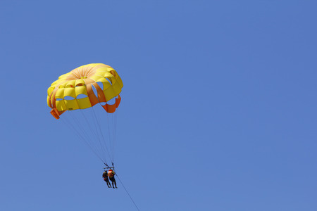 A summer sport - parasailing at beach