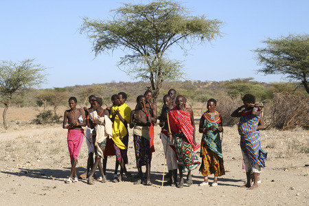 SAMBURU RESERVE, KENYA - JUNE 09, 2009  Group of unidentified African men from Samburu tribe posing for a portrait on June 09, 2009 in a local village near Samburu National park のeditorial素材