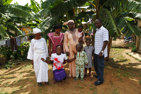 AKURE, NIGERIA - AUGUST 12, 2012  The members of a nigerian family from Akure, show their traditional clothes for a portrait, in a local village at Ondo state in Nigeria, on August 12, 2012のeditorial素材