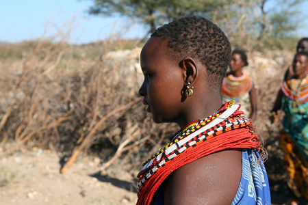 SAMBURU RESERVE, KENYA - JUNE 9, 2009  A girl from Samburu tribe in traditional clothes, on July 19, 2009 in a local village near Samburu National park のeditorial素材
