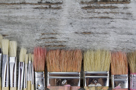 Set of paintbrushes in a wood background, vintageの写真素材