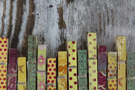 Handmade clothespins in a wood background, vintageの写真素材