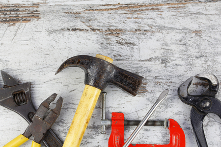Set of old tools in a wood backgroundの写真素材