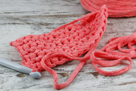 Crochet detail in a wood backgroundの写真素材