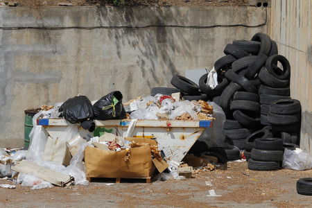 Rubbish in a container, with many tiresの写真素材